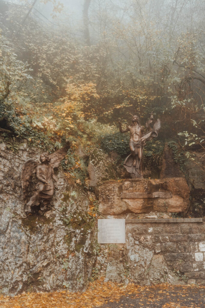 Madonna Della Corona bronze statue - The Sanctuary of Madonna Della Corona, an Italian Church Built into a Cliff